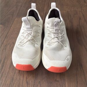 On Running Cream and Orange Athletic Shoes